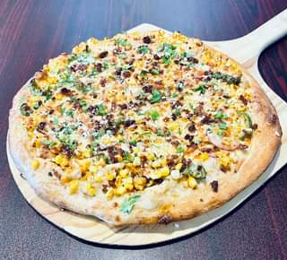 Don’t miss the pizza this week, The Mexican Corn Pizza!!! We start with mayo, so